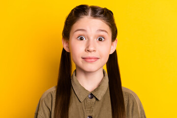 Fototapeta premium Photo portrait of small girl amazed surprised wearing casual outfit isolated on bright yellow color background
