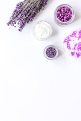 Obraz na płótnie Canvas lavender flowers in organic cosmetic set on white background top view mock-up
