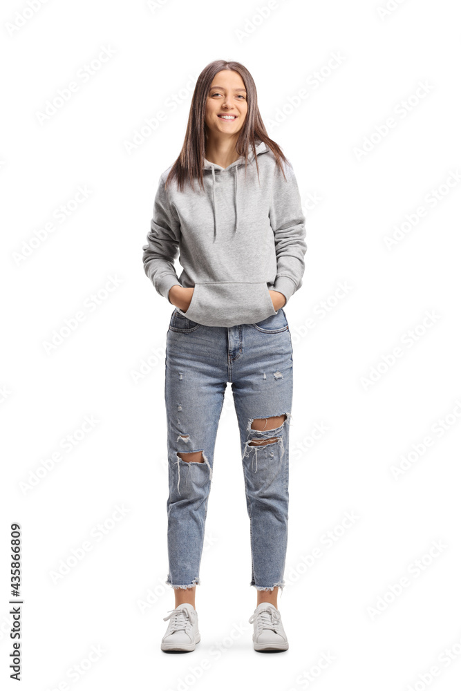Wall mural Full length portrait of a female hipster wearing a hoodie and jeans - Wall murals