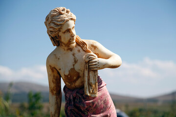 a beautiful girl statue in the garden