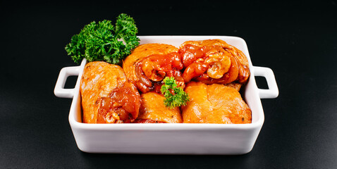 Free range chicken thighs on table. Raw chicken marinated thigh . The view from the Top. Food...