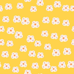 Random white scandi flowers silhouettes seamless doodle pattern. Yellow bright background. Naive style.