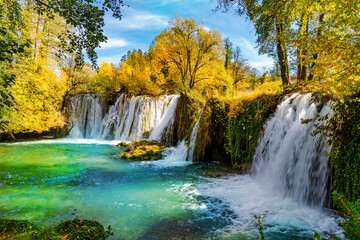 Beautiful view of the Rastoke National Lakes Park  in the fall season with a big waterfall and a natural river in Croatia