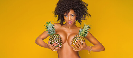 attractive girl with exotic pineapples