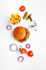 Homemade burgers with pickles and fries. Top view