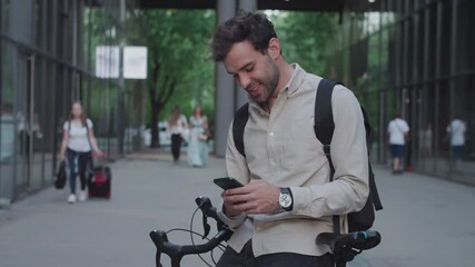 Man texting while sitting on the bike - Powered by Adobe