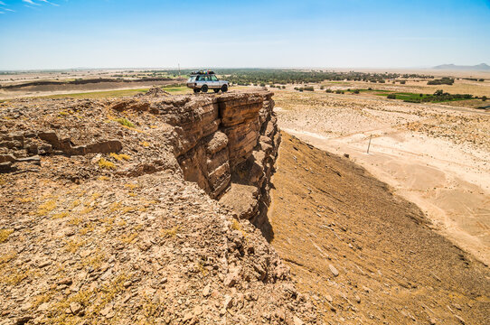 Erfoud, Morocco - April 15, 2015. Old vinage off road car on viewpoint on rock cliff