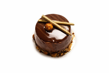 Chocolate and caramel cake isolated on a white background.