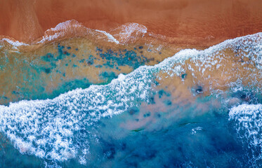 Concept aerial top view summer sunny travel image. Turquoise water with wave with sand beach background