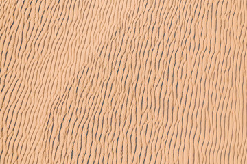 Wind wave vortices in sand background from aerial top view - obrazy, fototapety, plakaty