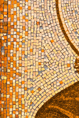 Orange mosaic background. Colorful Small ceramic mosaic patter. Abstract background, vertical image. .