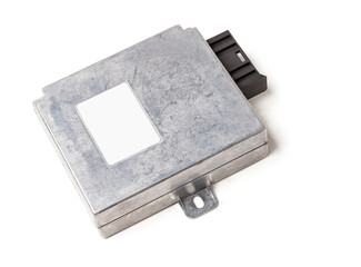 Plastic car engine control unit with metal elements on a white isolated background is the...