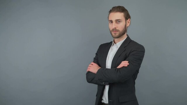 Portrait of his he nice-looking attractive masculine cheerful cheery bearded healthy content guy folded arms isolated over light gray background