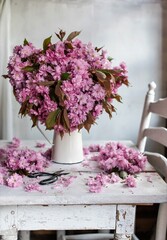 Beautiful bouquet pink flowers. lilac flowers. cherry flowers in vase .