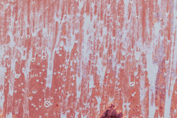 Surface with dripping white paint. Color - Coral Tree, Hue Red. Rust.