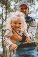 Child girl playing with father outdoor happy family smiling daughter and dad traveling together...