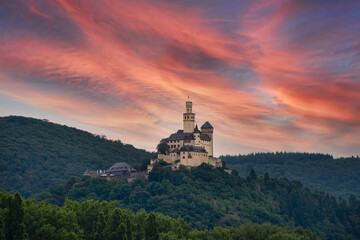 Fototapeta na wymiar Stunning sunset sky backdrops a historic castle
