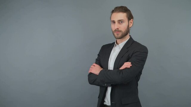 Portrait of his he nice-looking attractive lovely masculine bearded guy folded arms isolated over light gray pastel background