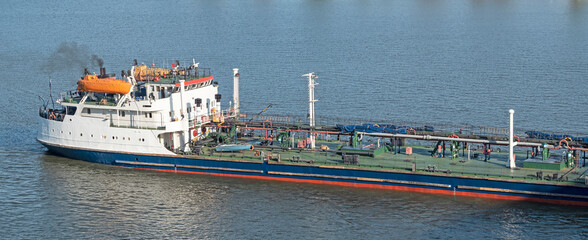 Cargo tank on water. Bulk oil carrier ship