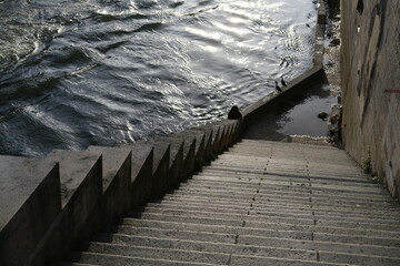 Some stairs and the Sein river in Paris. May 2021, France.
