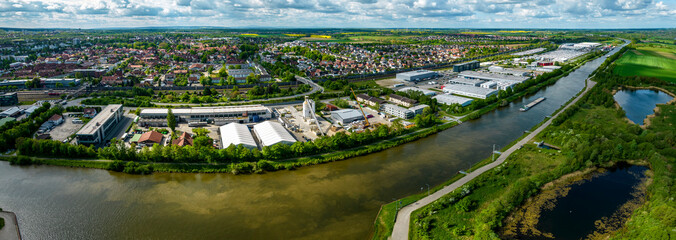 Aerial view of the cities wolfsburg and Fallersleben in Germany on a sunny day in spring. - obrazy, fototapety, plakaty