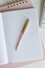notebook and pen on the table