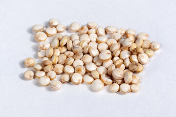 white quinoa seeds close up macro isolated on white background