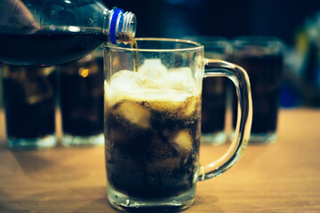 Refreshing Bubbly Soda Pop with Ice Cubes. Cold soda iced drink in a glasses - Selective focus, shallow DOF	
