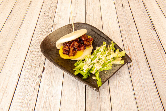 Bao Bread Sandwich With Teriyaki Chicken And Lettuce Salad