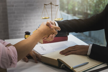 The lawyer shook hands with the client after completing the consultation in the case.