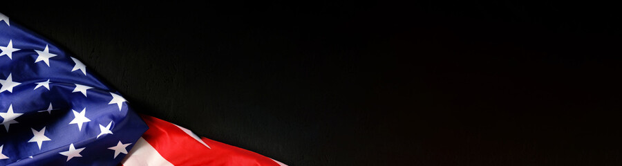 Banner Panorama Flag of the United States of America Copy space Black background USA.