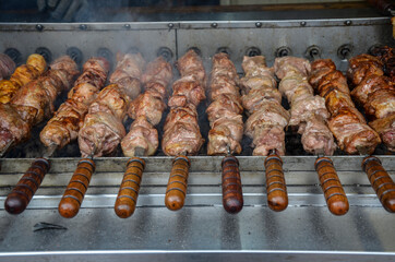 Cooking on the grill over charcoal Fresh tasty barbecue pork on skewers