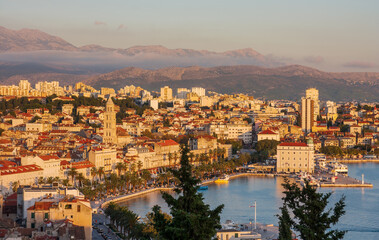 Fototapeta premium Split, Dalmatia, Croatia. Riva Promenade view from the Marjan Hill during sunset.