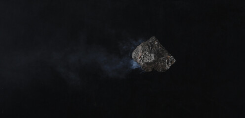 flying asteroid meteorite in black space