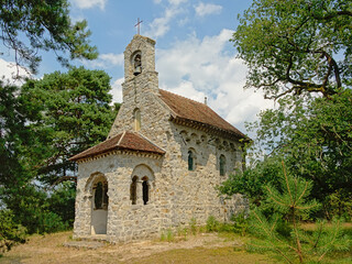 Naklejka premium Little old roman chapel in the forest of Ermenonville, France