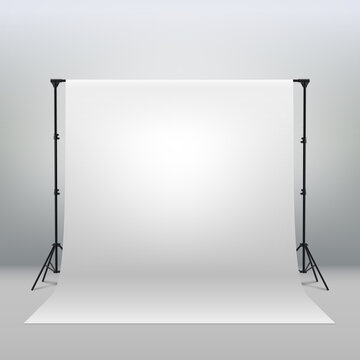 Professional photo studio interior. Photography tripods and racks and paper roll