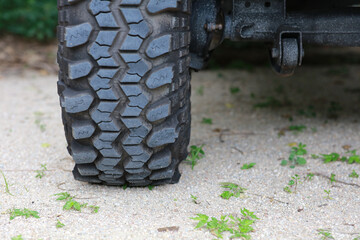 Close up of big tire of raly 4 wheel drive , adventure vehicle