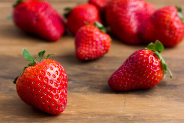 Still life of fresh red strawberries rustic style