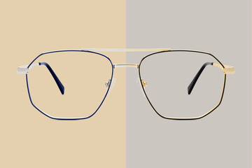 Silver and golden metal color eye glasses isolated on beige and gray background, ideal photo...
