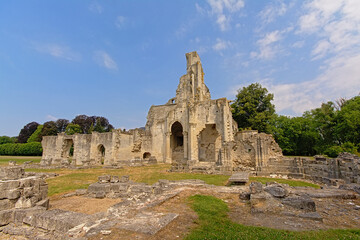 Fototapeta na wymiar Wide angle view on the ruins of the medieval Abbey of Chaalis, Ermenonville, France, on a sunny day with clear blue sky 