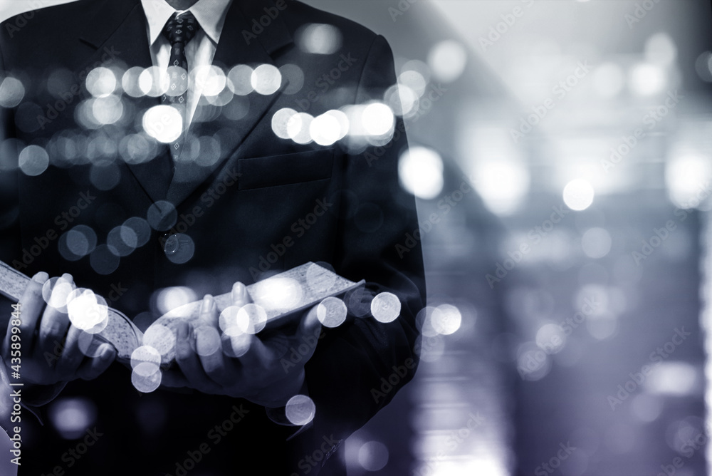 Poster abstract blurred city lights and building with a circular bokeh on blue background.