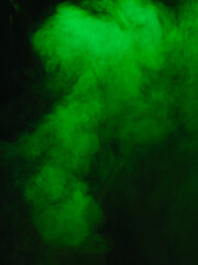 Obraz na płótnie Canvas Green smoke texture on black background