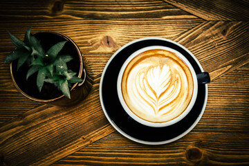 Coffee cup and beans on old vintage table. Top view with copy space for your text into the background.	
