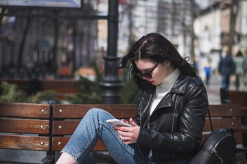 A beautiful young brunette hipster girl on the street of her city