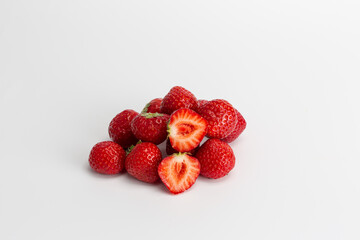 strawberries on a white background halves of berries