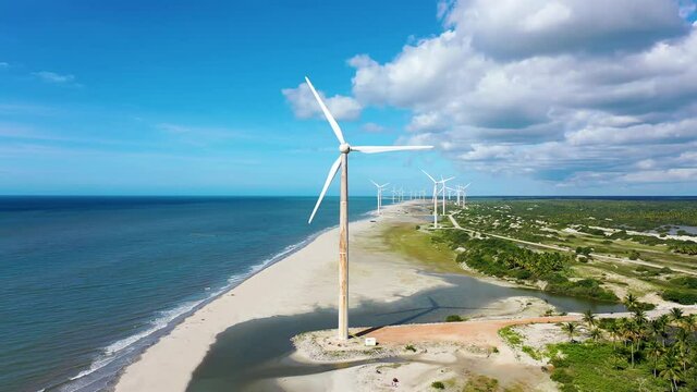 Beach view of wind farm in Jericoacoara, Ceara, Brazil.Green energy view.Beach view of wind farm in Jericoacoara, Ceara, Brazil.Green energy view.Beach view of wind farm in Jericoacoara, Ceara.