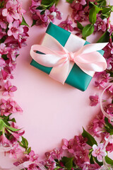 postcard mockup. floral frame made of pink flowers, envelope and white blank for the text. congratulation. invitation 