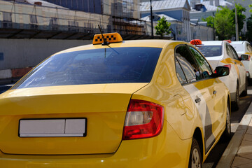 Parked yellow taxi, side view