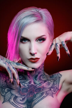 Portrait of a pretty young tattooed woman