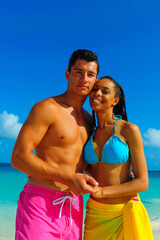 Couple at the beach, close-up, interracial, standing on the shore